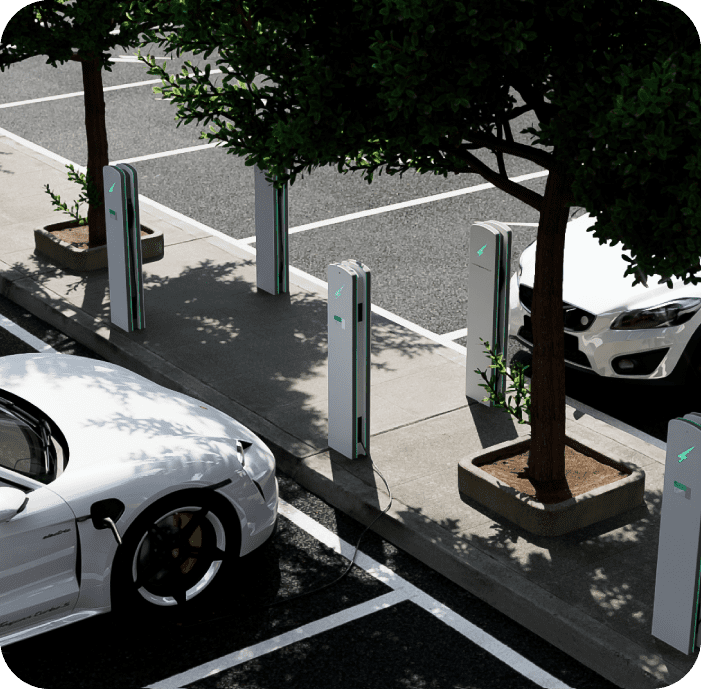 Parking lot with electric vehicle charging stations and a few parked cars.